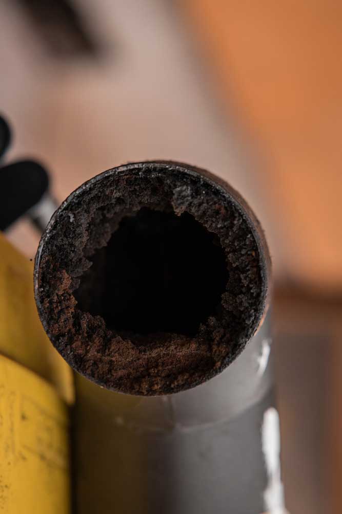 Build-up of creosote in pipe.